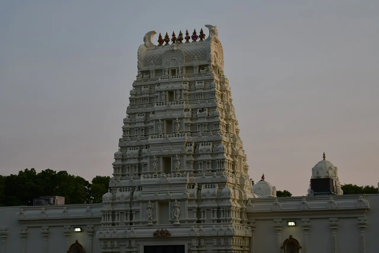 White gopuram tower of the Sri Lakshmi Temple in Ashland, Massachusetts, at dusk